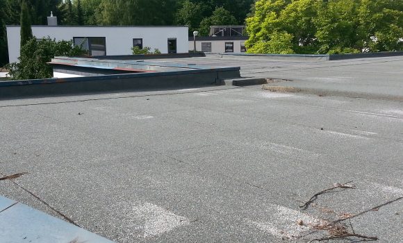 High school governing body fined after worker falls from roof